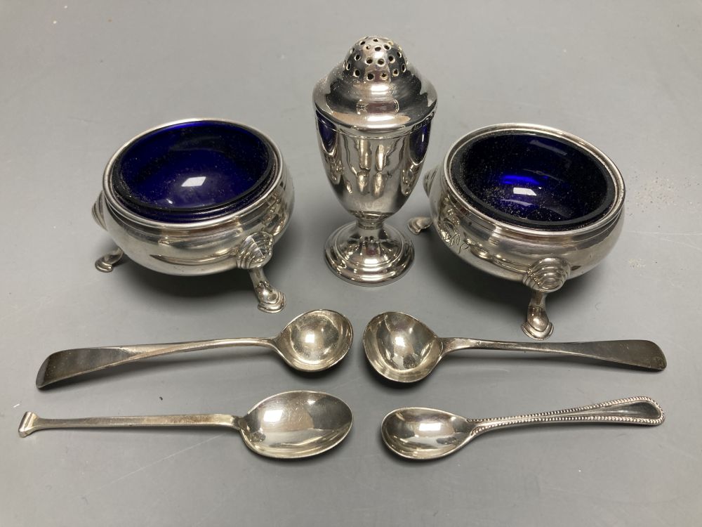 A pair of Georgian silver circular salts, a George III urn-shaped pepper pot and 4 various spoons.